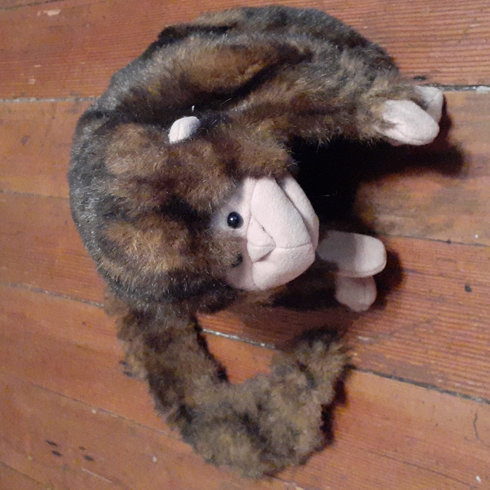 Folkmanis monkey hand puppet.  (Minor tail damage)